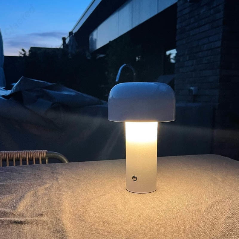 Small wireless mushroom-shaped bedside lamp.